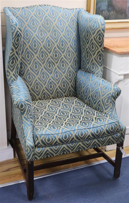 A George III wingback armchair